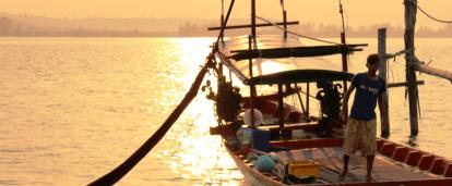A Khmer staff member prepares the boat for Projects Abroad volunteers A Khmer staff member prepares the boat for Projects Abroad volunteers